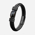 Photo d'un bracelet noir en cuir tressé et pierre plate.