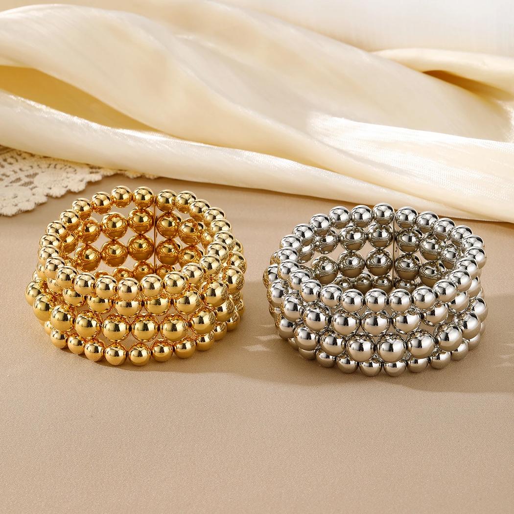 Bracelet fantaisie au 4 rangées de perles  pour femme