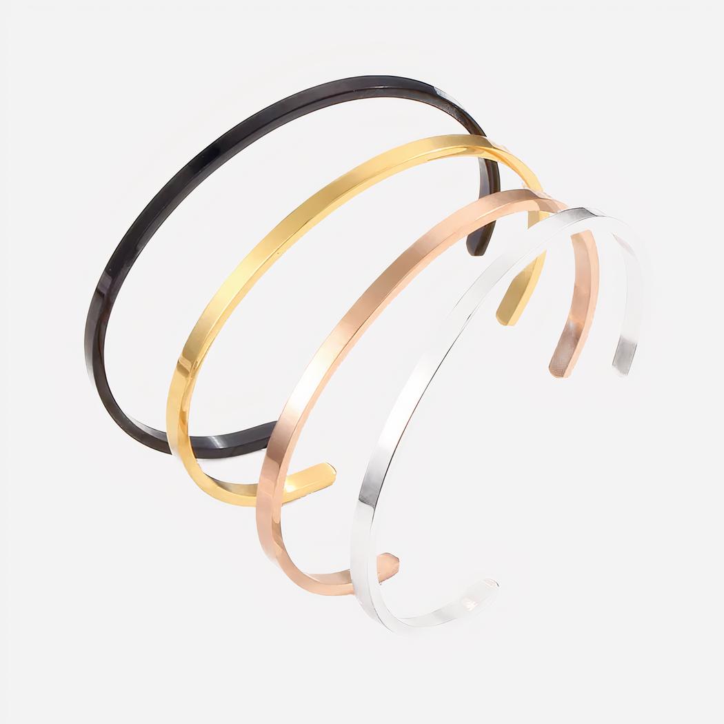 4 bracelets jonc ouverts ; noir, doré, rose, argenté