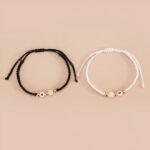 Deux bracelets amitié noire et blanc