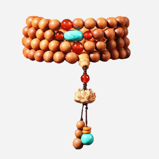 Photo d'un bracelet bouddhiste 108 perles en bois de santal et d'un pendentif fleur de lotus.